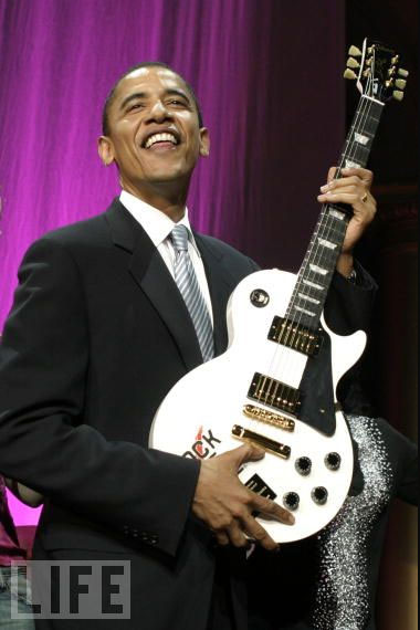 Obama with a Les Paul guitarr