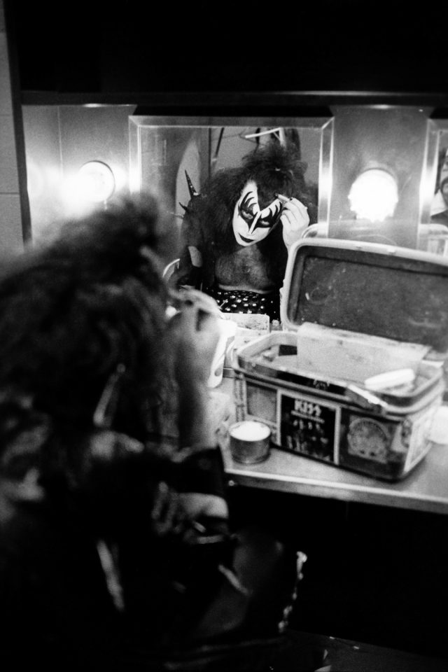 UNITED STATES - MAY 16:  Photo of KISS and Gene SIMMONS; Gene Simmons backstage in dressing room putting on make up,  (Photo by Fin Costello/Redferns)